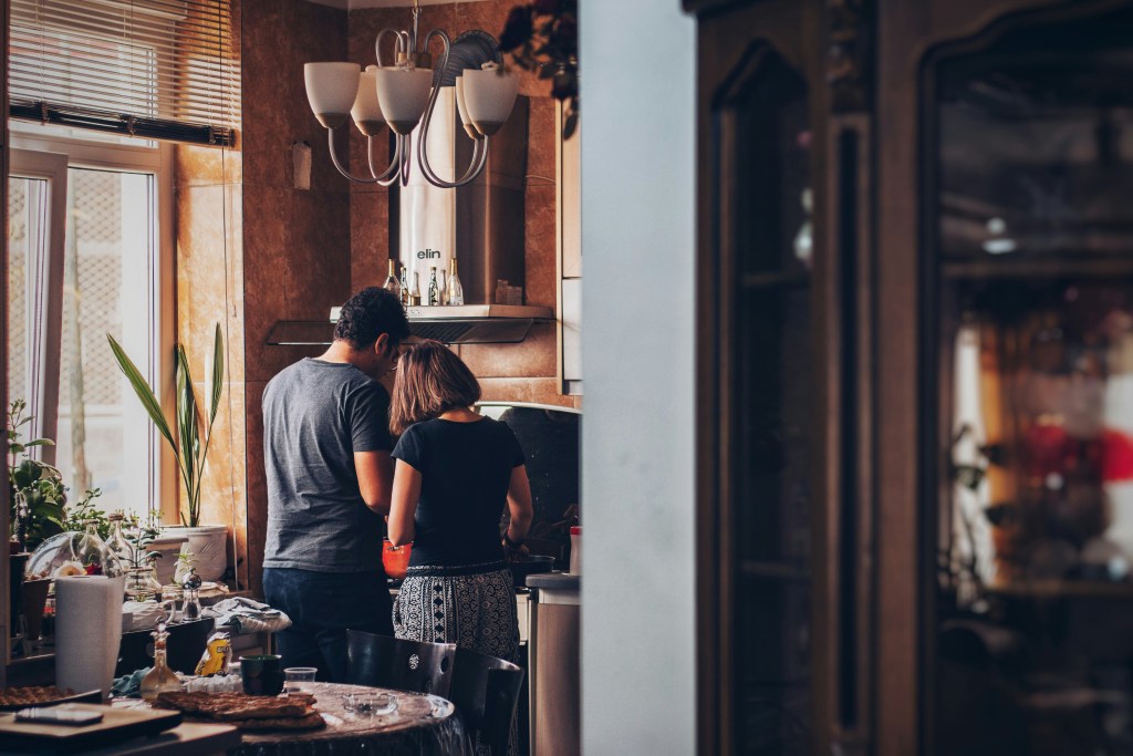 two homebuyers enjoying their kitchen
